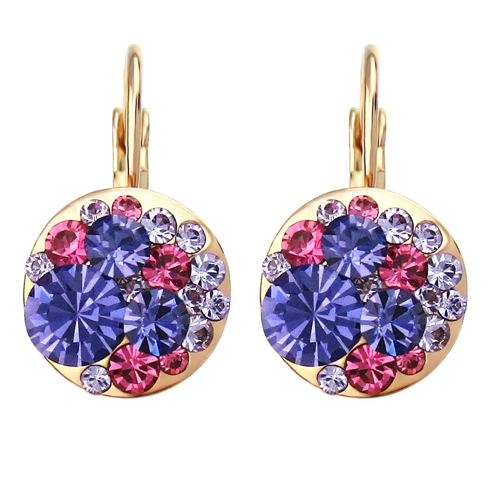 Golden Halo Crystal Drops Radiant elegance framed in 18K gold.