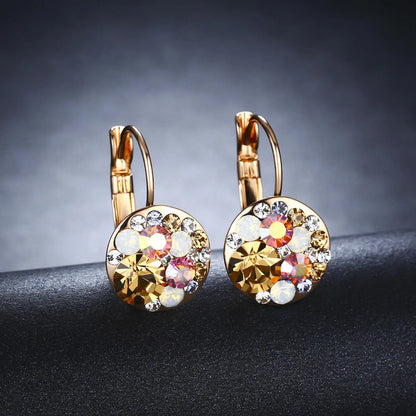 Golden Halo Crystal Drops Radiant elegance framed in 18K gold.