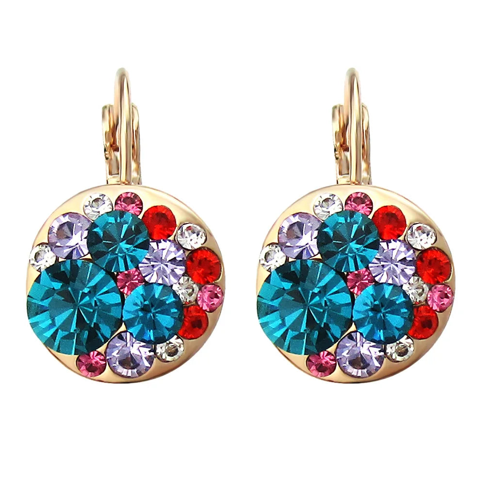 Golden Halo Crystal Drops Radiant elegance framed in 18K gold.