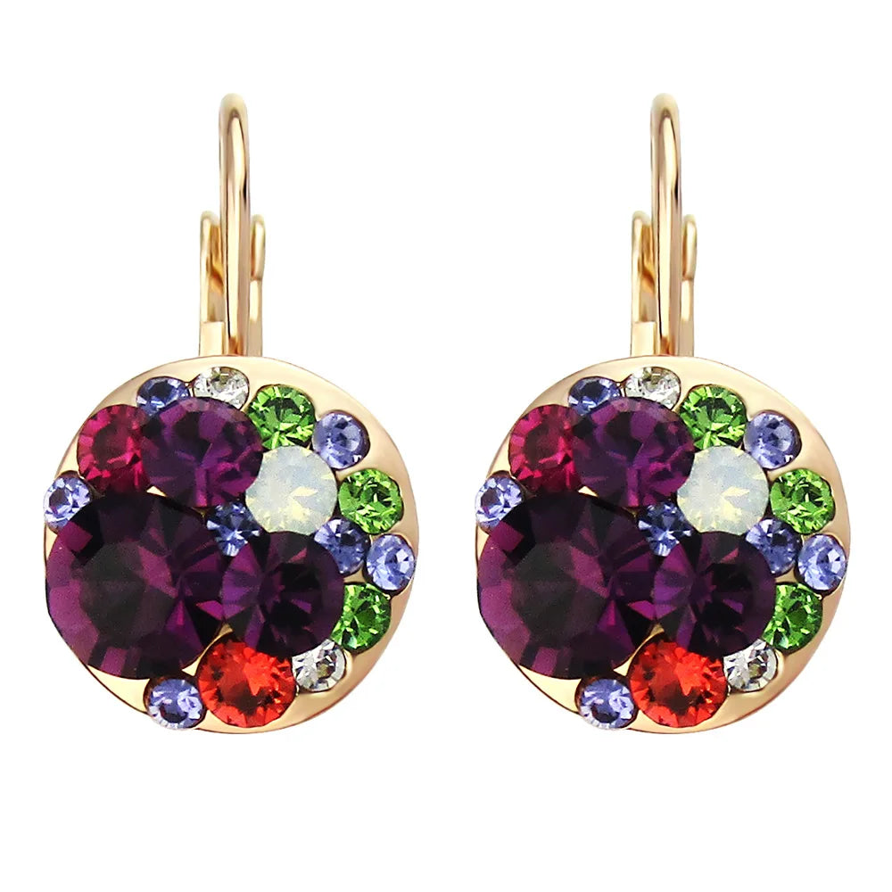 Golden Halo Crystal Drops Radiant elegance framed in 18K gold.