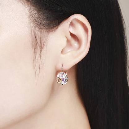 Golden Halo Crystal Drops Radiant elegance framed in 18K gold.
