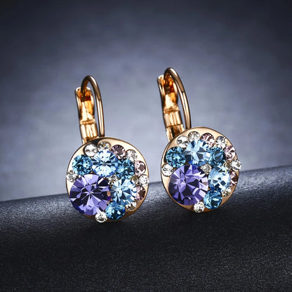 Golden Halo Crystal Drops Radiant elegance framed in 18K gold.