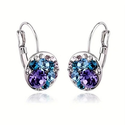 Golden Halo Crystal Drops Radiant elegance framed in 18K gold.