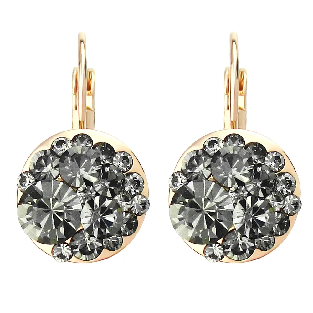Golden Halo Crystal Drops Radiant elegance framed in 18K gold.